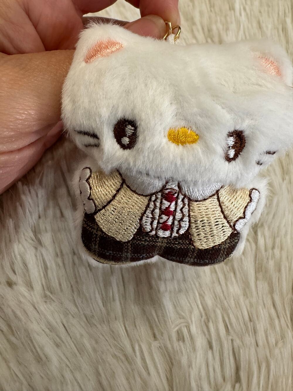 Hello Kitty white plush embroidered keychain with brown plaid skirt beige bow